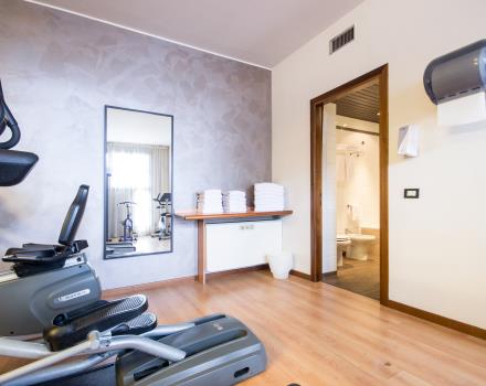 view of the gym and the entrance of the bathroom