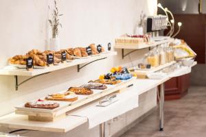 Continental Breakfast buffet with fresh croissaint, cakes, biscuits and homemade bread