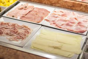 Best western modena district breakfast with meat cuts and cheese